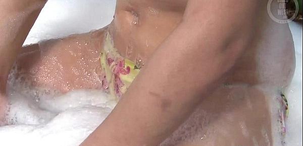  Pigtailed amateur chick masturbates in the bath tub